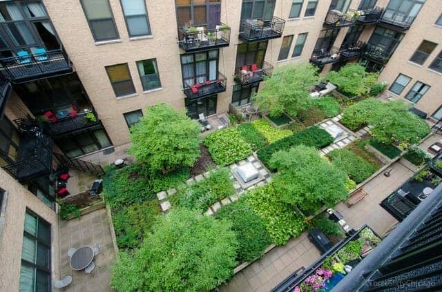 Photo looking down into the lush green interior garden courtyard at No. Ten Lofts in the Chicago West Loop neighborhood.