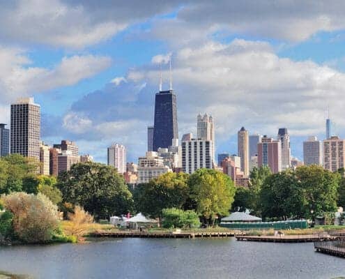 Chicago skyline with the Lincoln Park zoo lake in the foreground. Lincoln Park real estate, condos, lofts, homes, apartments for sale.