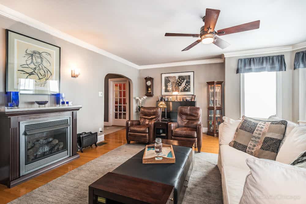 Arched entry to the living room with fireplace in this classic Chicago bungalow.