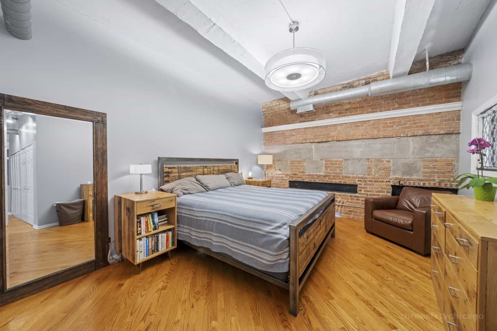 Primary bedroom in unit 610 at Trevi Square Lofts.